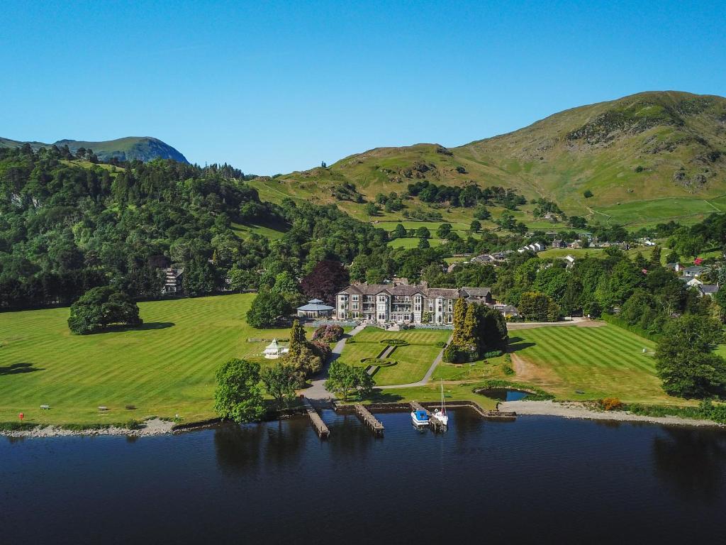 an aerial view of a house in the middle of a lake at The Inn On The Lake in Glenridding