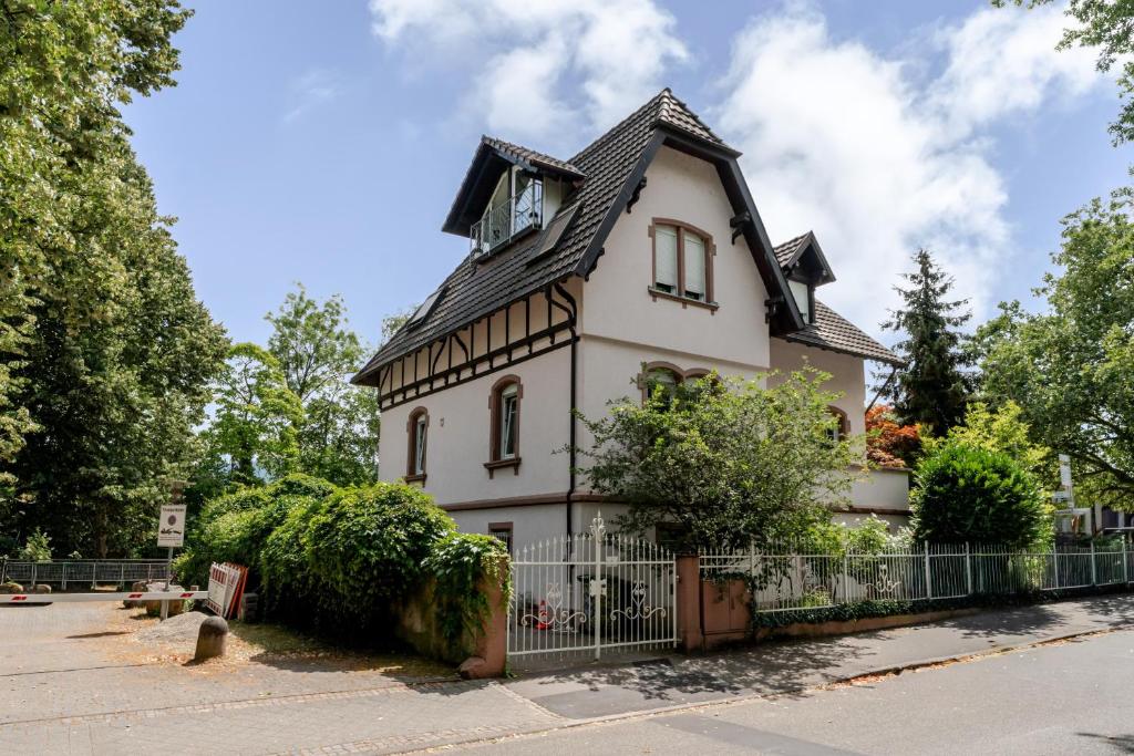 an old house with a gambrel roof at Villa Rosa in Offenburg
