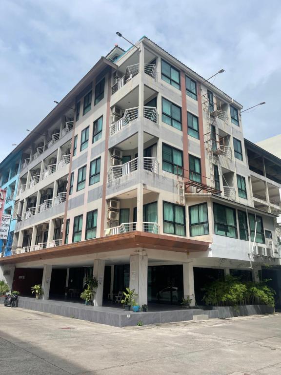 a large building with balconies on the side of it at New Abani in Jomtien Beach