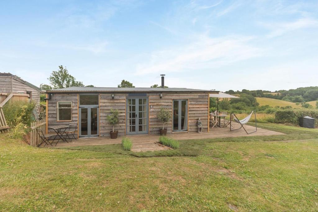 a log cabin with a deck and a yard at 2 Bed in Overton oc-k45280 in Overton