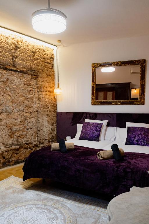 a bedroom with two beds and a mirror on the wall at Can marques in Cunit