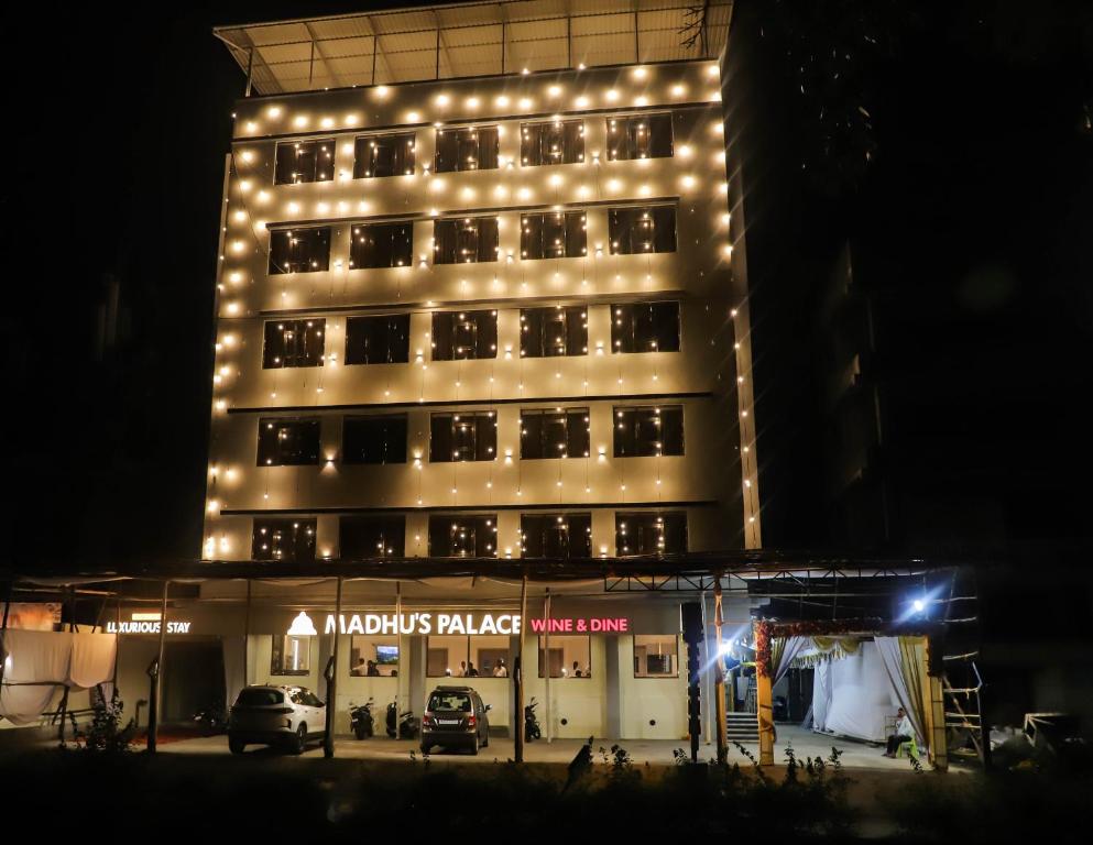 a building with lights on top of it at night at Madhu's Palace in Amarnāth