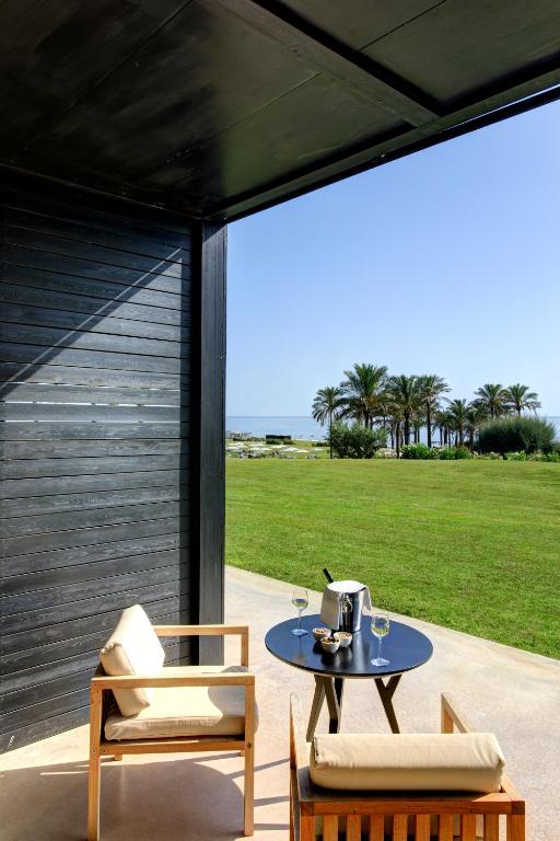 a patio with a table with a tea kettle on it at Verdura Resort in Ribera