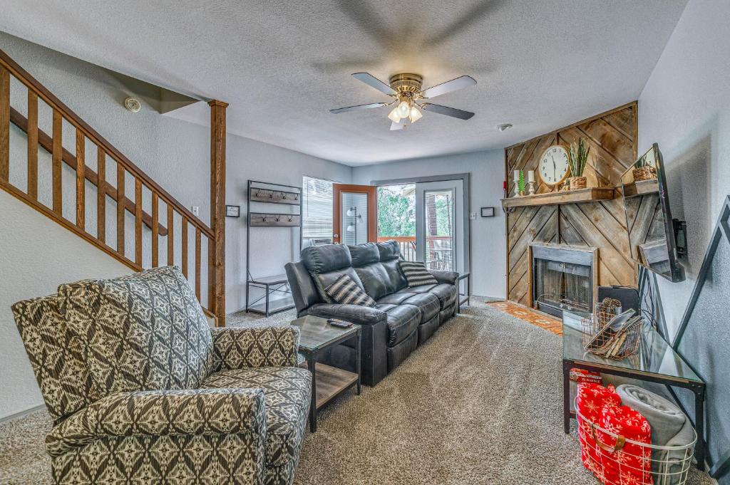 a living room with a couch and a fireplace at Hike, Golf & Explore: Ruidoso Retreat w/ Deck! in Ruidoso