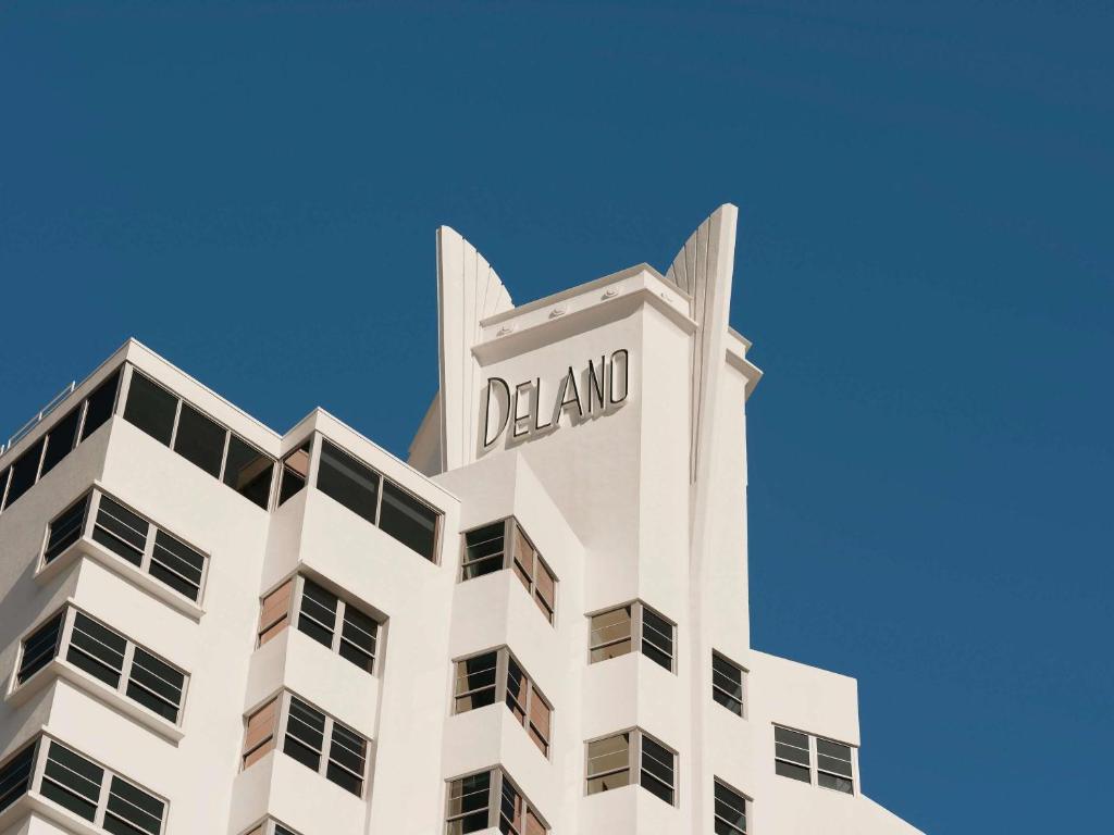 a tall white building with the word dial on it at Delano Miami Beach in Miami Beach