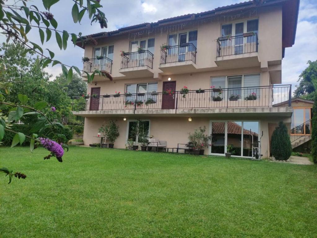 a house with a lawn in front of it at Miranis in Byala