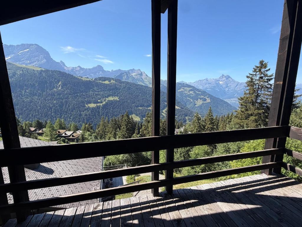 a view of the mountains from the porch of a house at Beautiful chalet with exceptional views, very quiet in Gryon