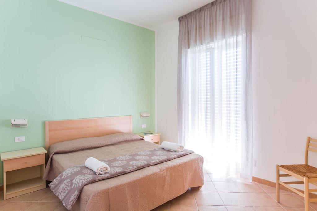 Postel nebo postele na pokoji v ubytování Residence Fontana Vecchia