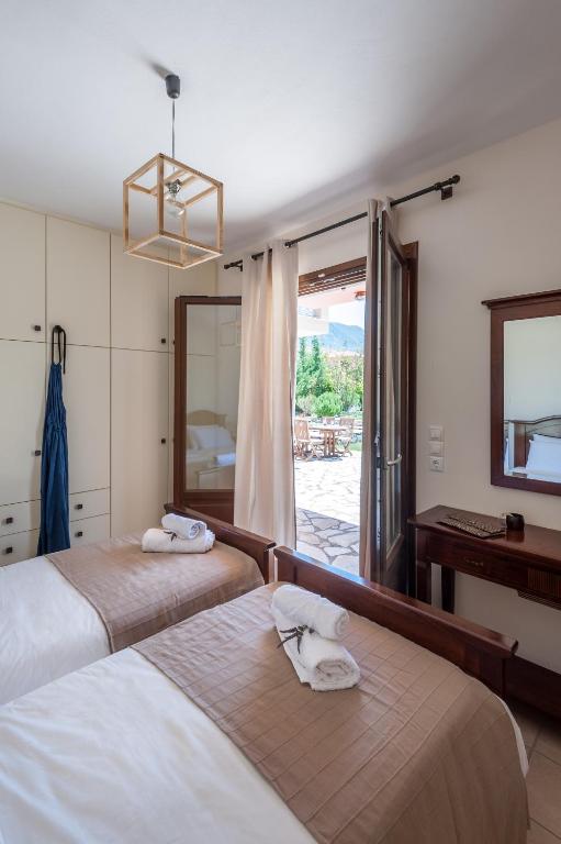 Postel nebo postele na pokoji v ubytování Penelope Villas