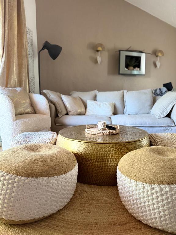 a living room with two tables and a couch at Bavella in Zonza