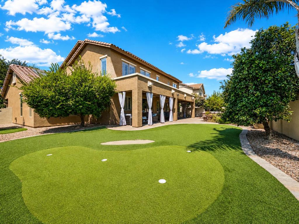a golf course in front of a house at The Jade House Queen Creek in Queen Creek