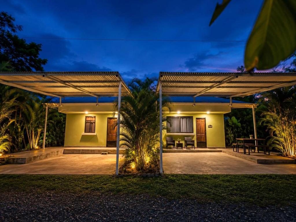 a patio of a house at night at Serenity House in Cahuita