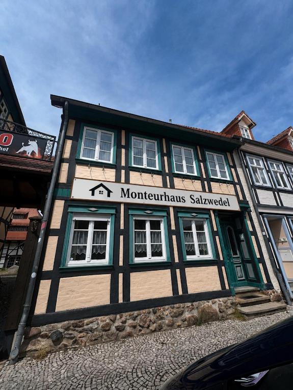 a building with a sign on the front of it at Monteurhaus Salzwedel in Salzwedel