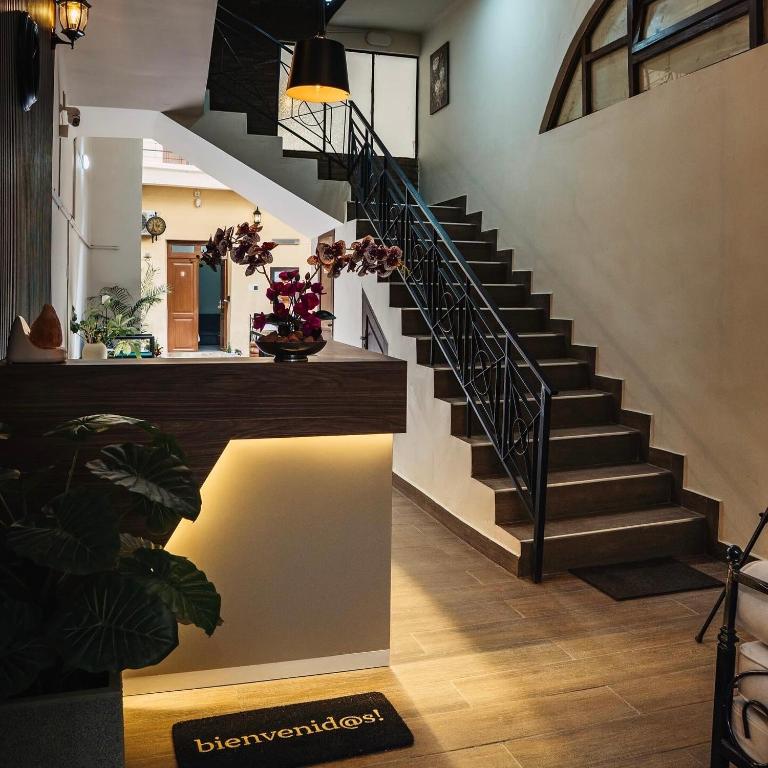a staircase in a house with a stair light at Hotel Boutique La Casona in Tarija