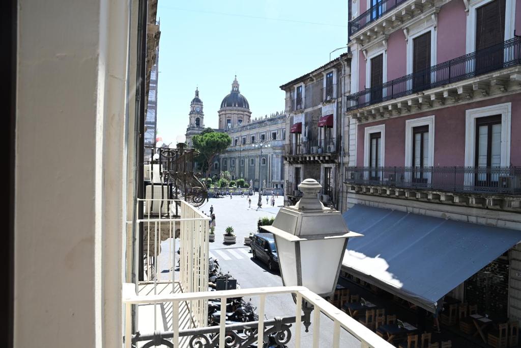 a view of a city street from a balcony at Vivere Hotel in Catania