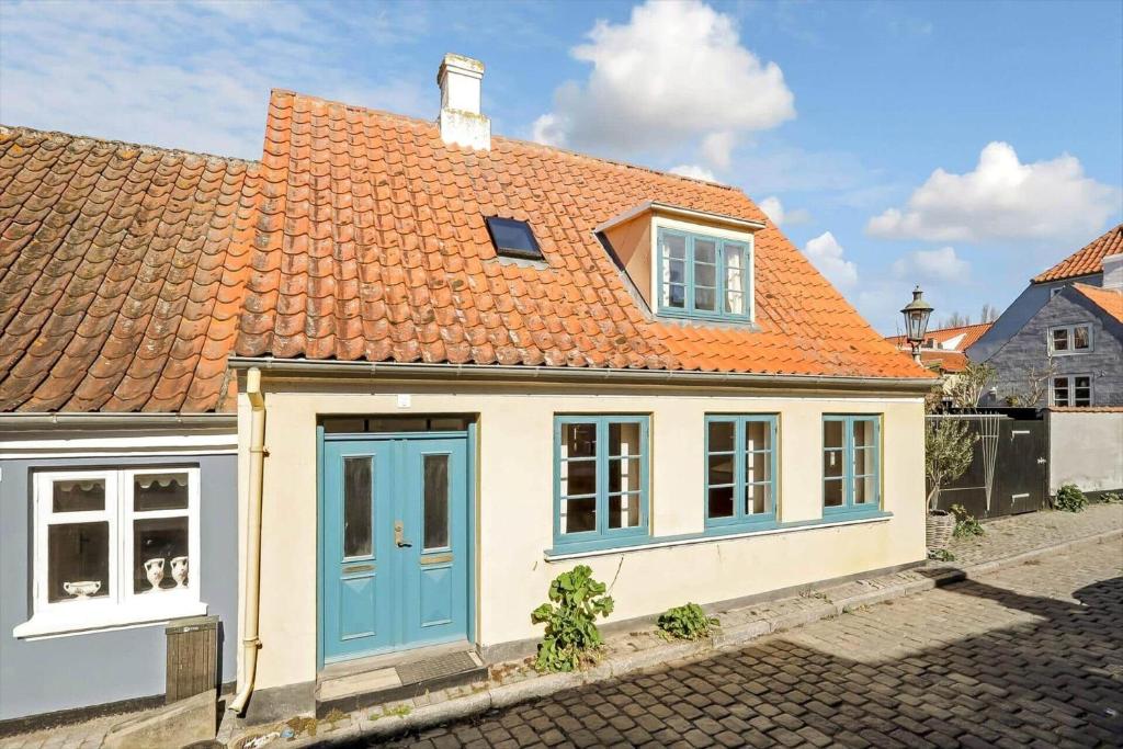 a small house with an orange roof at AE330-Aeroskobing-Ostergade-8 in Ærøskøbing