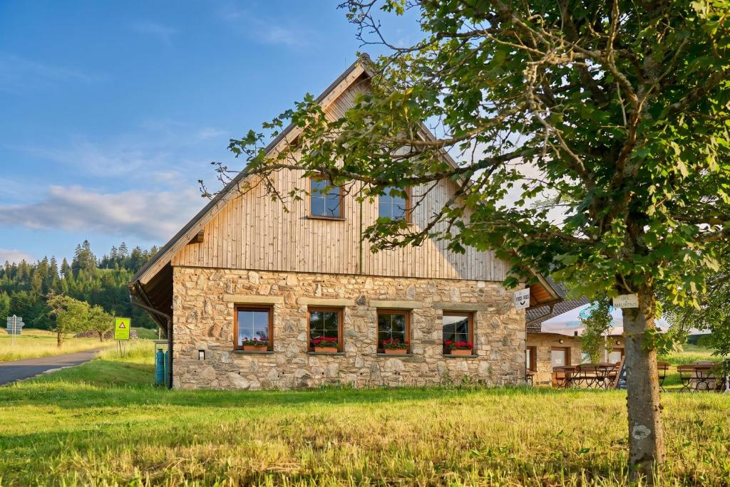 a stone house on the side of a road at Lenhart's Ryžovna by Mountain ways in Boží Dar