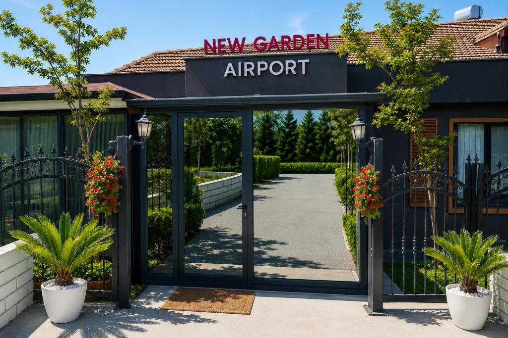 a new arrival airport entrance with potted plants at New Green Airport Hotel & Restaurant in Arnavutköy