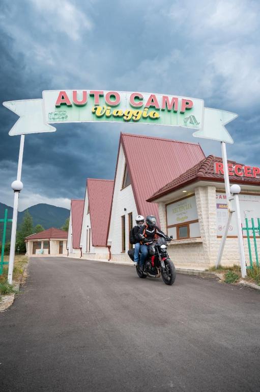 a motorcycle parked in front of a autoco camp motel at Viaggio Berane in Berane