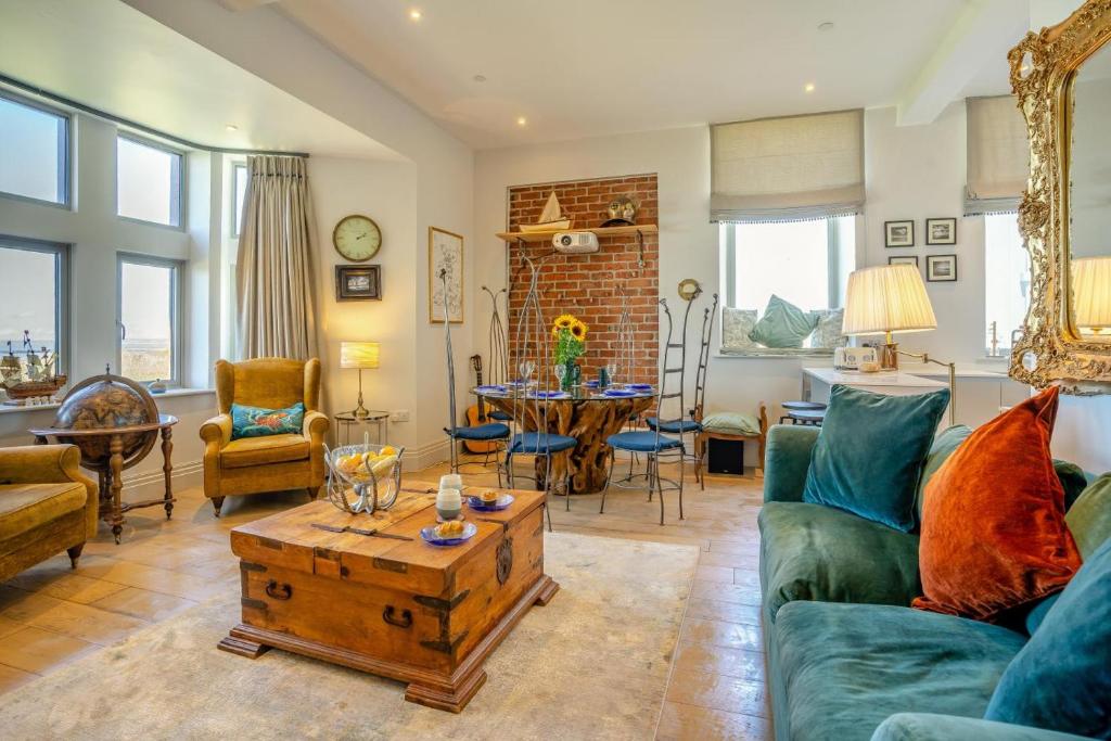 a living room with a couch and a table at 2 Bed in Porthcawl oc-87294 in Porthcawl