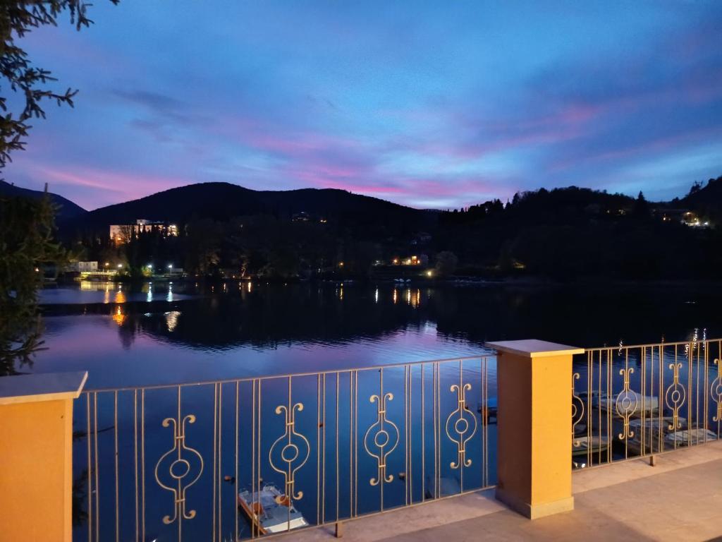 a view of a lake at night at Setteacque Lakeview Rooms in Piediluco