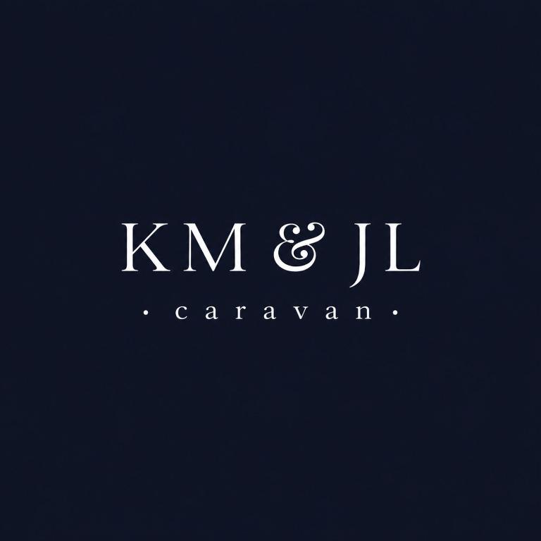 a white logo on a black background at KM & JL Caravan in Cresswell