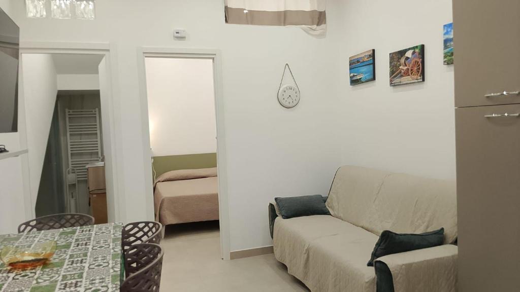 a living room with a couch and a table at House Mare Blu in Balestrate
