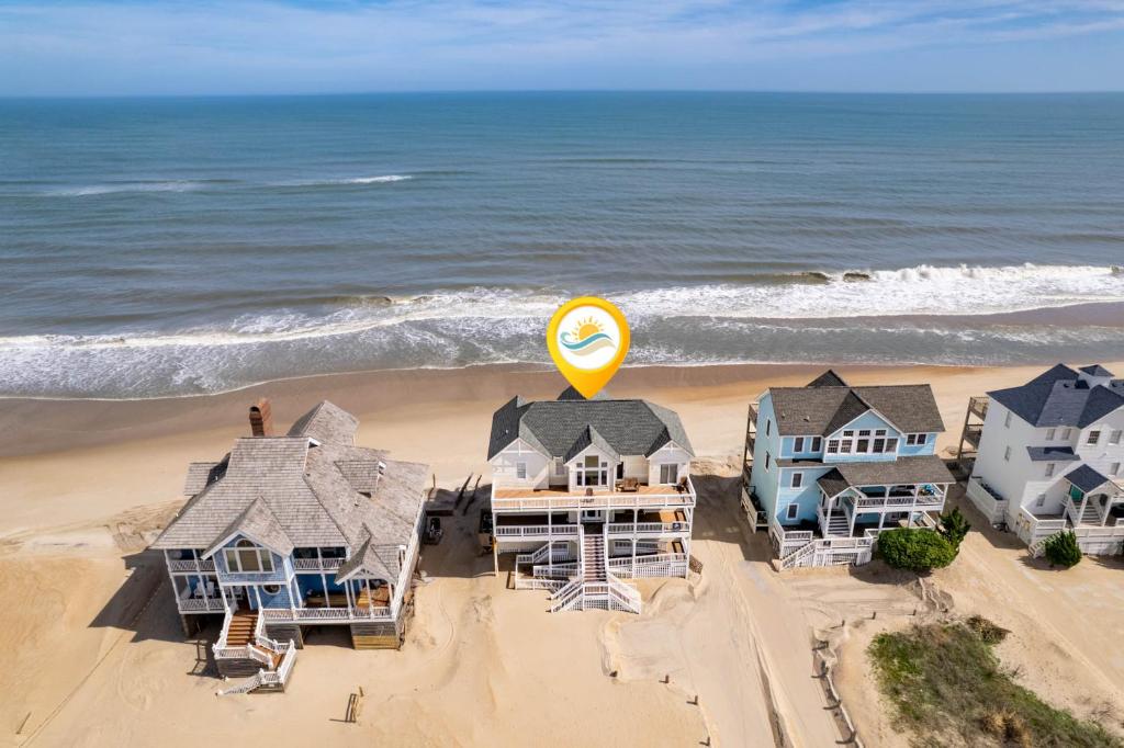 an aerial view of houses on the beach at 8045 - Mirlo Hi in Rodanthe