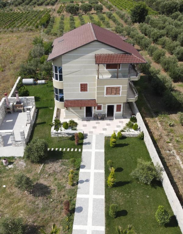 an aerial view of a house in a vineyard at Residence Rudaj in Vlorë