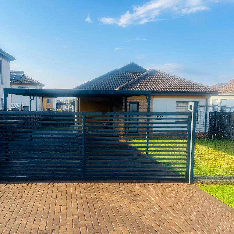 a fence in front of a house at House in Pretoria