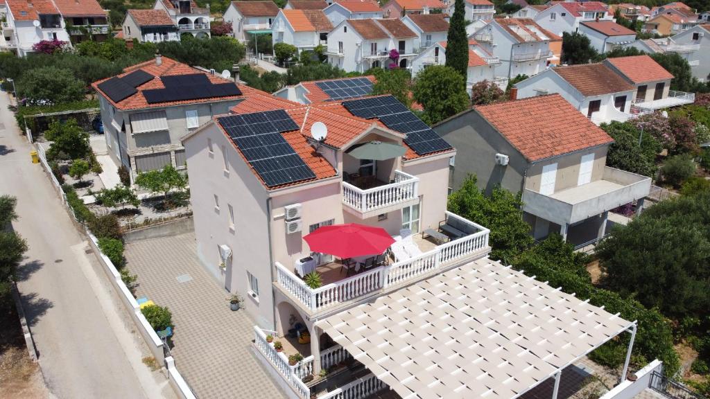 an aerial view of a house with solar panels on its roof at A.M. in Orebić