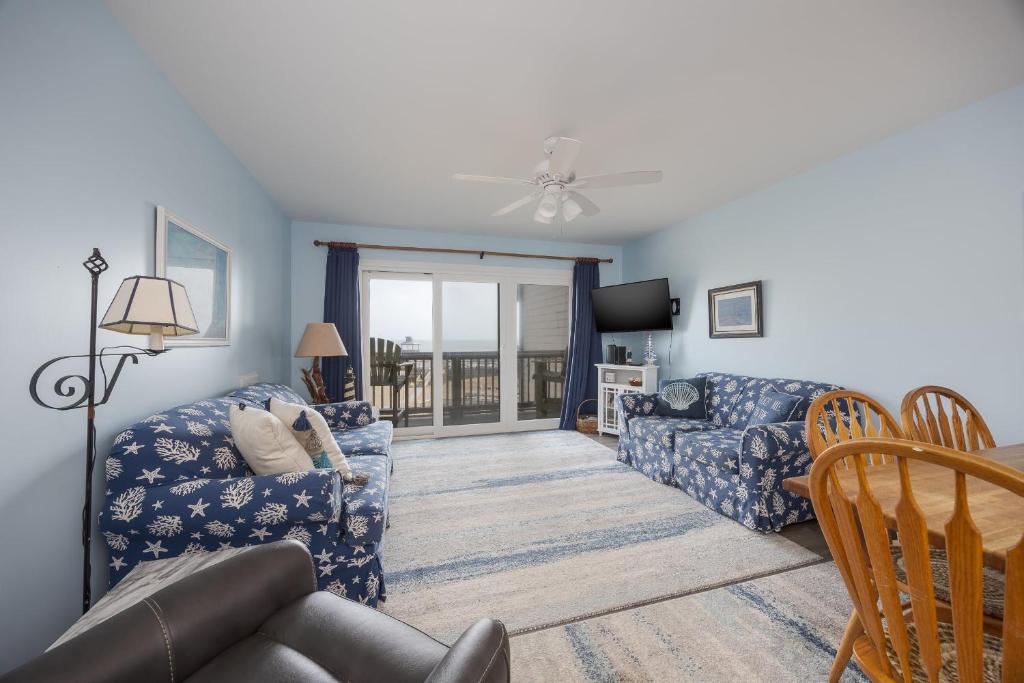 a living room with a couch and a chair at 2973 - The Shack in Duck