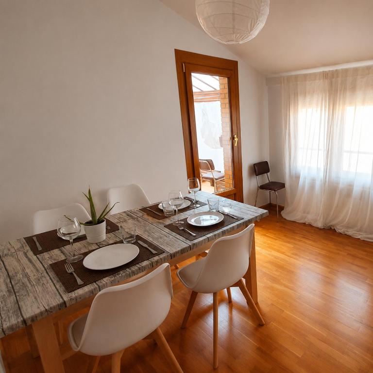 a dining room with a table with chairs and a tableasteryasteryasteryasteryastery at El Burgo Eclipse Retreat in El Burgo de Osma