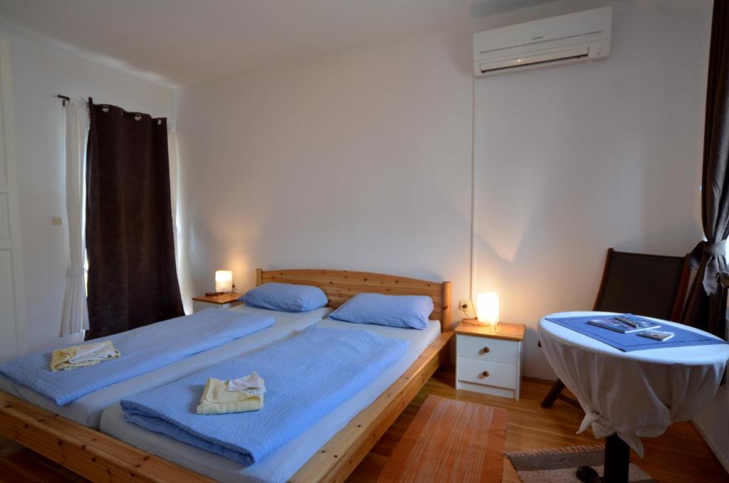 Postel nebo postele na pokoji v ubytování Apartment Akaju