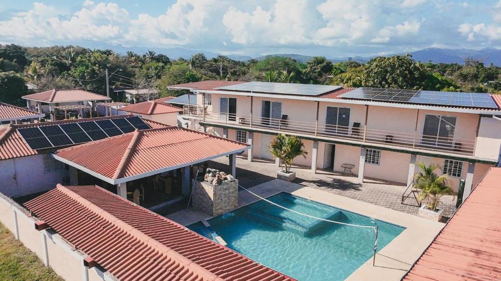 an aerial view of a house with a swimming pool at Cabañas de Asgard in Nueva Gorgona