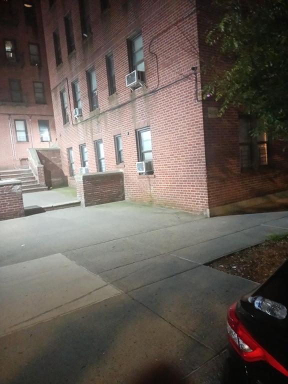 an empty street in front of a brick building at Anderson home services in Woodlawn