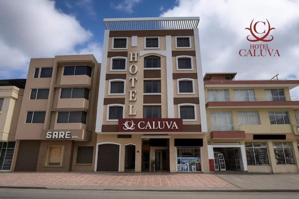 a building with a sign on the front of it at Hotel Caluva in Loja