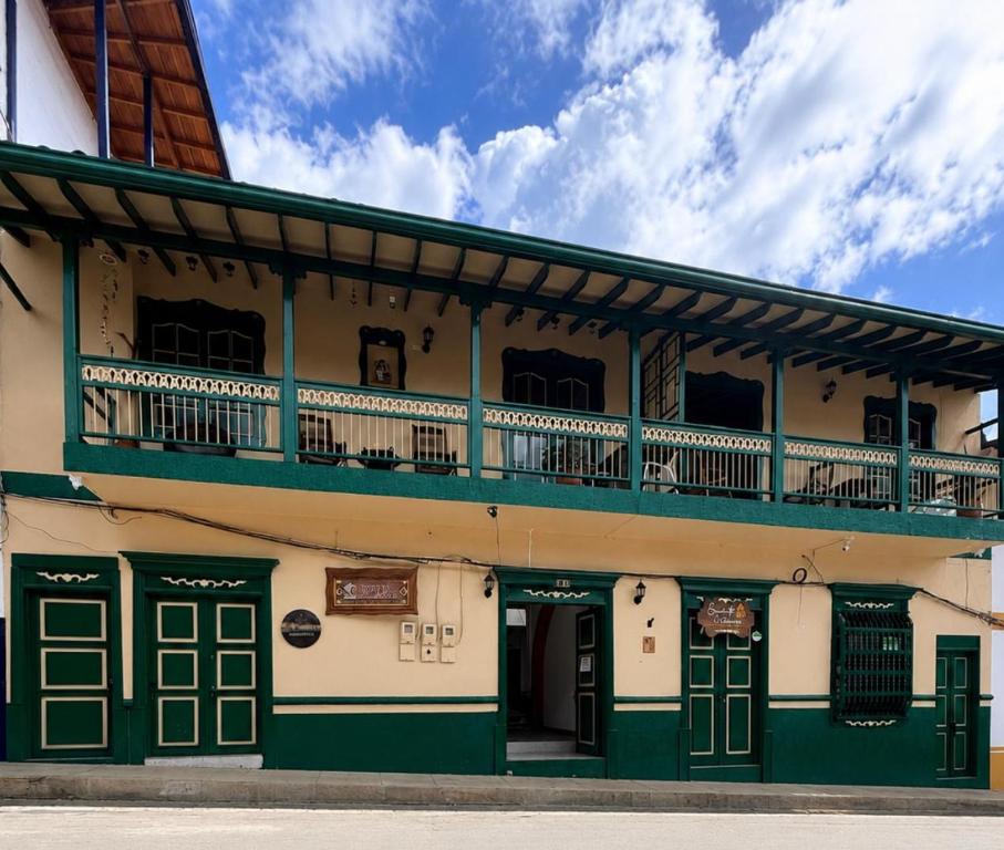 an old building with a balcony on top of it at Hotel Barajas in Jardin