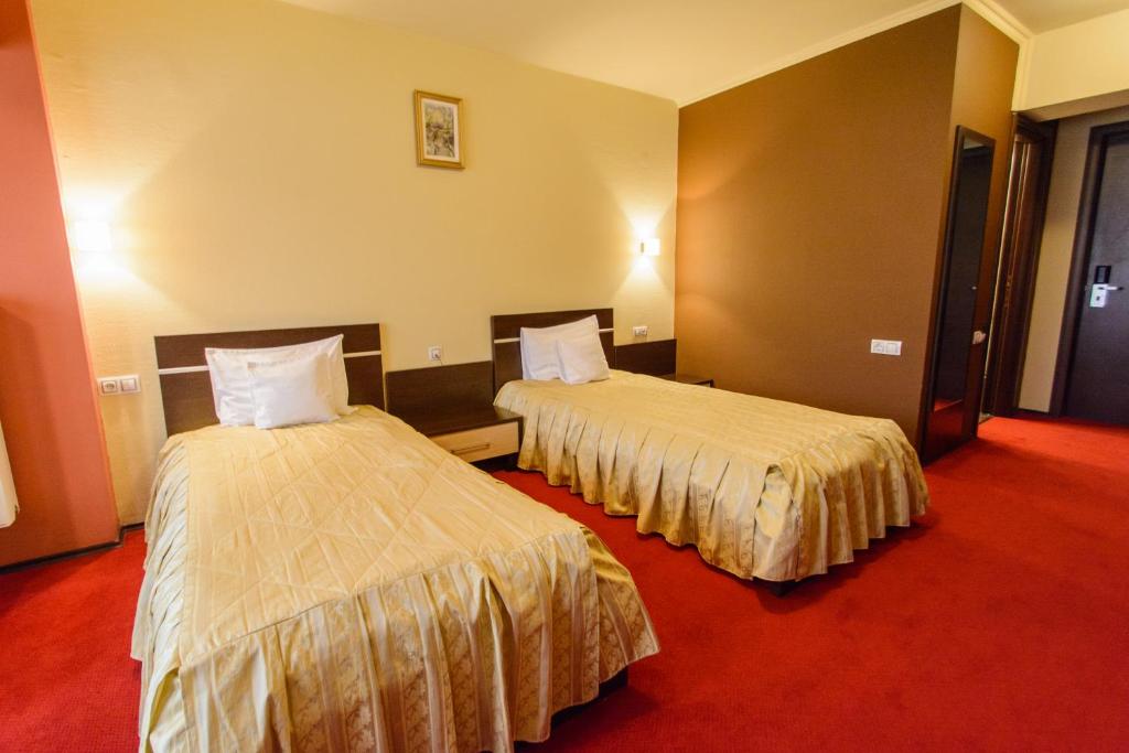 Postel nebo postele na pokoji v ubytování Hotel Q Art Severus