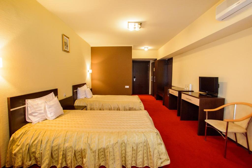 Postel nebo postele na pokoji v ubytování Hotel Q Art Severus
