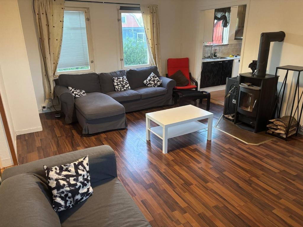 a living room with a couch and a coffee table at Villa in Kvidinge