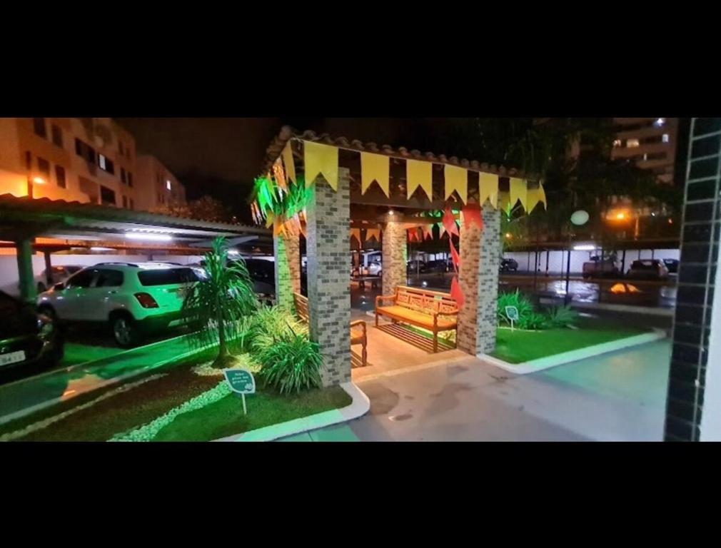 a pavilion in a parking lot at night at Apto amplo e confortável in Aracaju