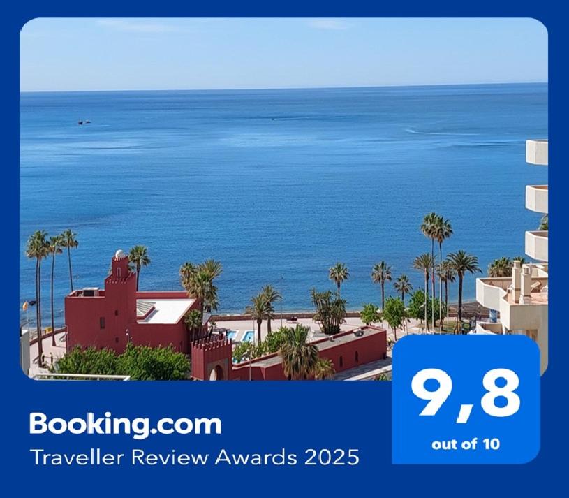 a sign for a hotel with a view of the ocean at Benal Beach Vibe in Benalmádena