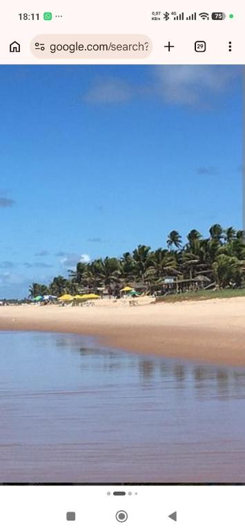 a screenshot of a picture of a beach at Duplex Praia de Imbassaí in Mata de Sao Joao
