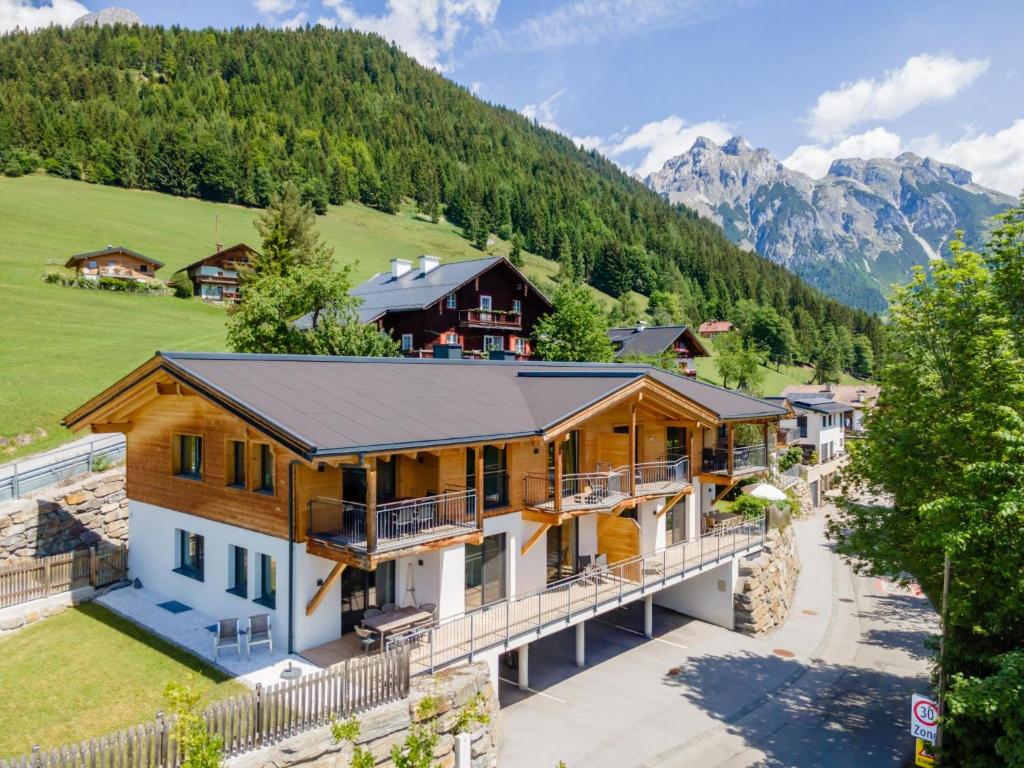 an aerial view of a house with mountains in the background at Werfenblick und Bergblick in Werfenweng