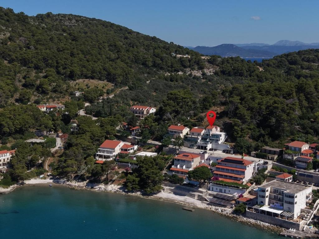 an aerial view of a resort on a lake at Apartments by the sea Cove Saplunara, Mljet - 12849 in Maranovići