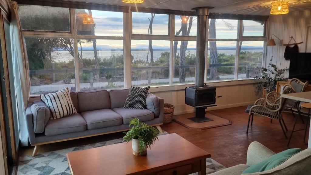 a living room with a couch and a stove at The waterfront retreat in Lock Sport