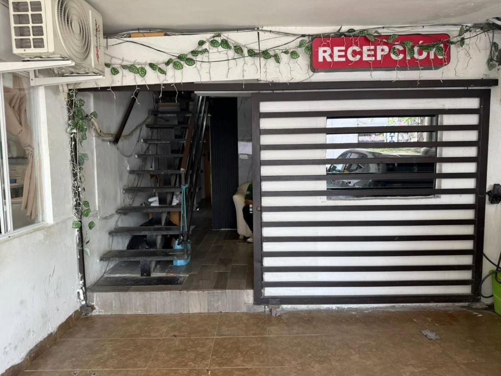 a garage door with a car parked in it at Hotel Vahuma in Monterrey