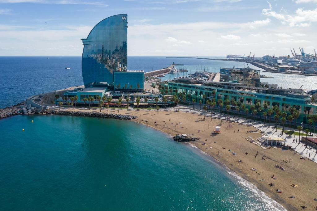 an aerial view of a beach with a building at W Barcelona in Barcelona