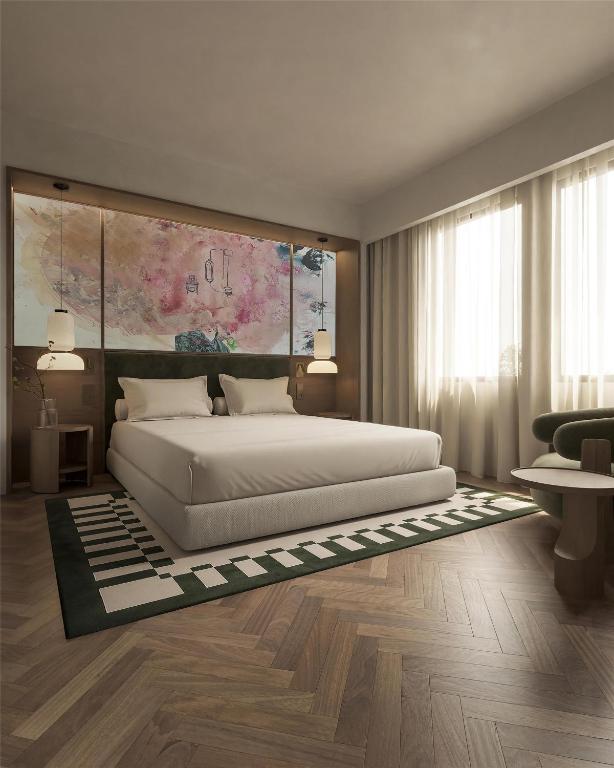 a bedroom with a large bed and a large window at DoubleTree by Hilton Madrid Principe de Vergara in Madrid